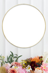 Golden floral frame mockup on a white wall