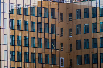 Corner of a brown glass and steel office building.