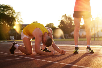 Very upset Losing athlete in a race at the stadium