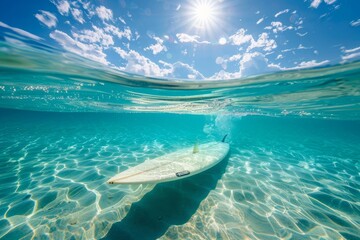 A white surfboard drifting under clear water in a blue sky setting, A surfboard floating in clear blue water with the sun shining above