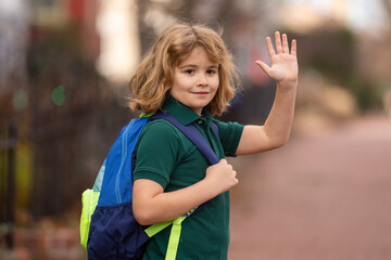 Naklejka premium Schoolkid getting on the school bus. American School. Back to school. Kid of primary school. Happy children ready to study. Bye bye. Educational concept.