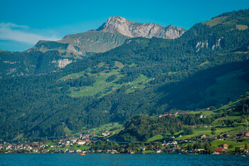 Switzerland landscape. Village on Lake in Switzerland. Mountain scenery in the Alps . Switzerland Alps. Landscape of touristic alpine village. Switzerland Mountain panorama.