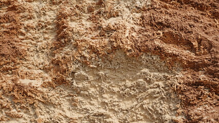 A mountainous sandy surface. Natural reddish texture