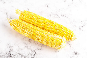 Sweet yellow raw corn cob