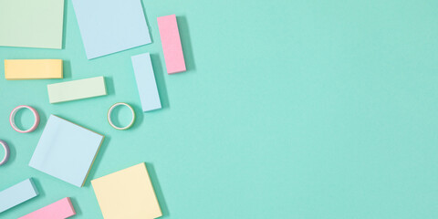 Set of Note paper with different color, adhesive tape and tack. Blank sheet, sticky note, torn piece isolated on pastel mint background. Back to school concept.