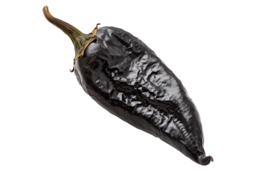 Black chipotle or Ancho chili pepper isolated on a white background.