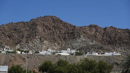 Rugged Mountain Landscape With White Houses Clear Sky Day