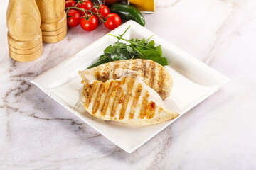 Grilled chicken breast served arugula