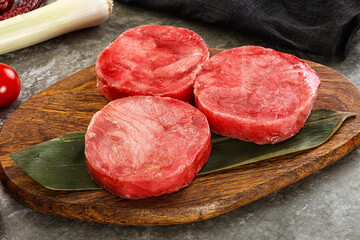 Delicous raw tuna medallion for cooking