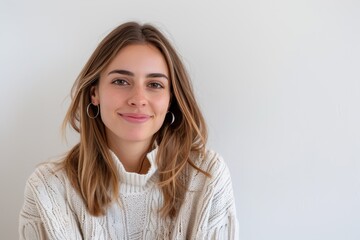 Obraz premium Smiling Woman in White Sweater with Hoop Earrings. Generative AI.