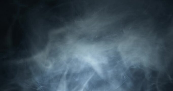Ambient, abstract smoke and light motion background. Strange, glowing, alien, UFO light, ghost or spirit with smoke and fog for halloween or science fiction, sci-fi background.