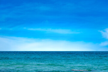 Ocean sea background and the clear sky For summer vacation ideas Nature of summer sea water with sunlight The sea sparkles against the blue sky	