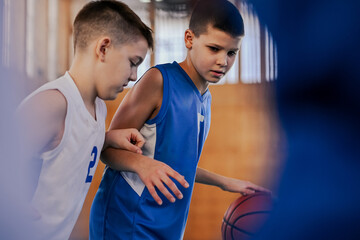 Determined kid playing basketball