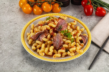 Italian pasta cellentani with anchovy