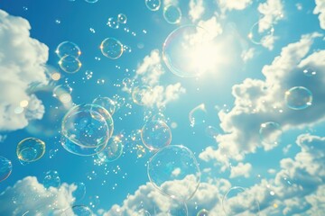 Soap bubbles fly against the blue sky on a sunny day
