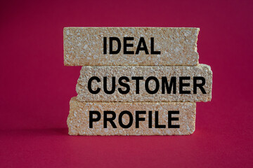 Ideal customer profile symbol. Concept words Ideal customer profile on brick blocks. Beautiful red background. Business ideal customer profile concept.