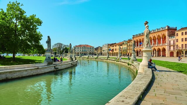 Statues of Publio Clodio Trasea Peto and Pagano Dalla Torre. Prato della Valle is elliptical square in Padova, Italy. It is largest square in Italy, and one of largest in Europe.