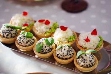 Tartlets with pate decorated with micro greens. Delicious and beautiful appetizers for a buffet table. catering services for banquets.