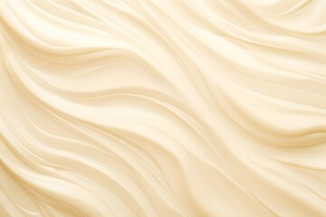 Fototapeta premium Closeup abstract background of smooth flowing white cream is great for a food or dessert concept