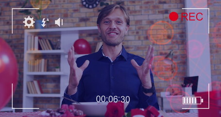 Image of icons and camera recording screen over caucasian man having online call