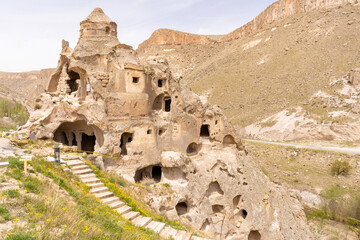 Türkiye Cappadocia Fairy Chimneys as Peri Bacalari. Volcanic rock landcsape of Fairy tale chimneys in Cappadocia with blue sky on background in Goreme, Nevsehir