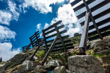 Avalanche barrier on the top of the mountain in the High Tatras in the summer season