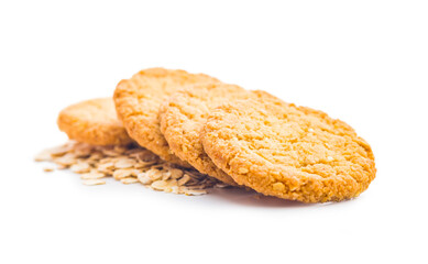 Tasty oatmeal cookies and rolled oat  isolated on white background.