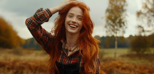 Smiling Woman in Autumn Field with Red Hair