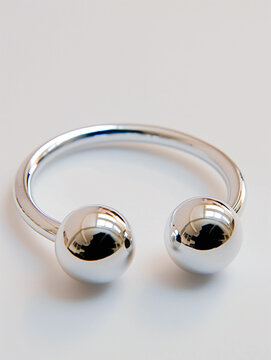 Delicate screwball bracelet, handcrafted in gleaming silver. Minimalist design, perfect for everyday elegance.