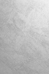 A textured wall with natural shadows illuminated by natural light.