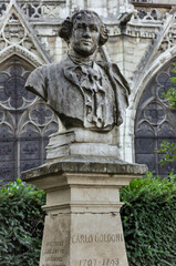 Obraz premium Sculpture dedicated to the Italian writer Carlos Goldoni, near the Notre Dame Cathedral, Paris, France, Europe