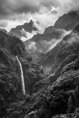 A serene waterfall in monochrome tones
