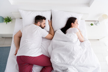 Photo of funny charming couple wear white t-shirts sleeping white sheets indoors apartment bedroom