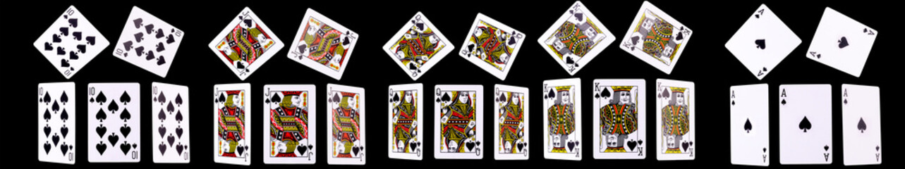 Playing cards for poker game on black background with clipping path.
