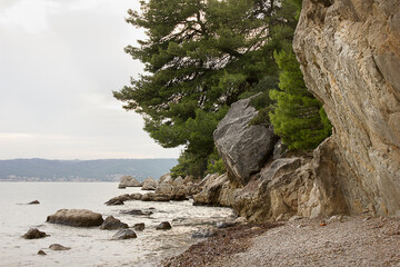 A rocky shore on the Adriatic Sea. Landscape with sea and mountains