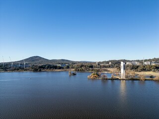 Clear view of Lake Burley Griffin with the National Carillon and mountains in the background