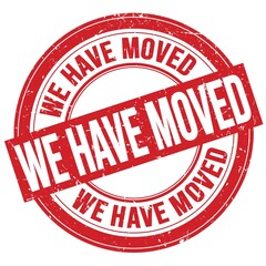 WE HAVE MOVED text written on red round stamp sign