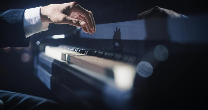 Close Up on Pianist Hands Playing an Exciting Jazz Melody on a Black Grand Piano. Anonymous Artist is Focused on Creating Beautiful Instrumental Song as He Practicing Playing on a Keyboard
