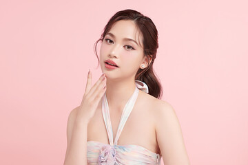 Beautiful young asian woman with clean fresh skin on pink background, Face care, Facial treatment, Cosmetology, beauty and spa, Asian women portrait.