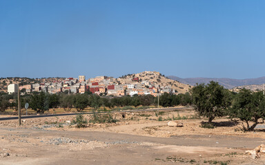 Morocco semi-deserts and mountains, north africa nature, Moroccan stone desert, red hills, villages and argan trees