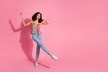 Full body photo of attractive young woman dance have fun dressed stylish sequins clothes isolated on pink color background