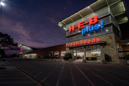 HEB plus fresh food and grocery store entrance with sign illuminated at night, Blue Rhino Propane, Bulverde, Spring Branch, Texas