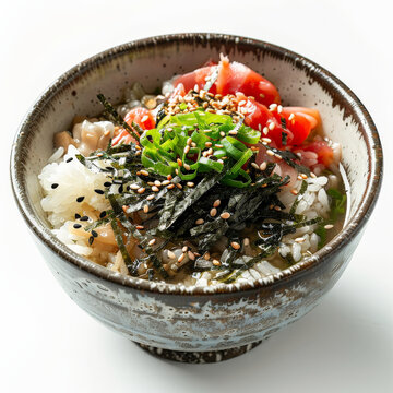 A bowl of ochazuke, rice with green tea broth, topped with umeboshi (pickled plum), nori strips, and sesame seeds, isolated on white background.