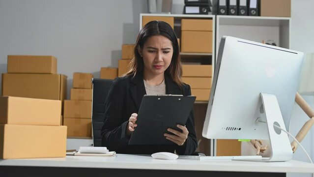 Young Asian owner woman prepare parcel box  woman is stressed, bored, and overthinking from working