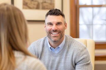 Obraz premium Smiling Man in Conversation with Woman at Home Office Setting