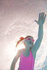 girl swiming  in  pool