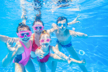 family swimming  in pool