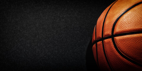 Dark web banner with detailed orange basketball and copy space for text. Professional sports backgrounds © serebryannikov