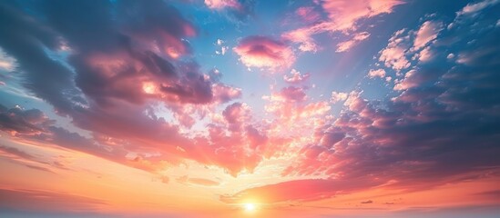 Spectacular sunrise and sunset sky with beautiful multicolored clouds and no birds in sight. Large panoramic view