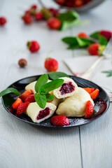 cooked sweet homemade steamed dumplings with strawberries